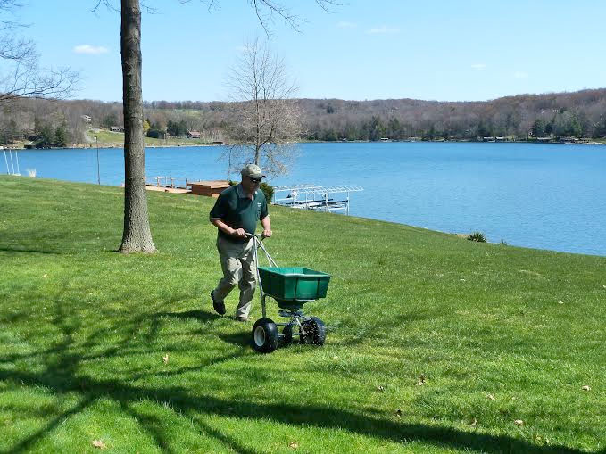 technician performing grub control service