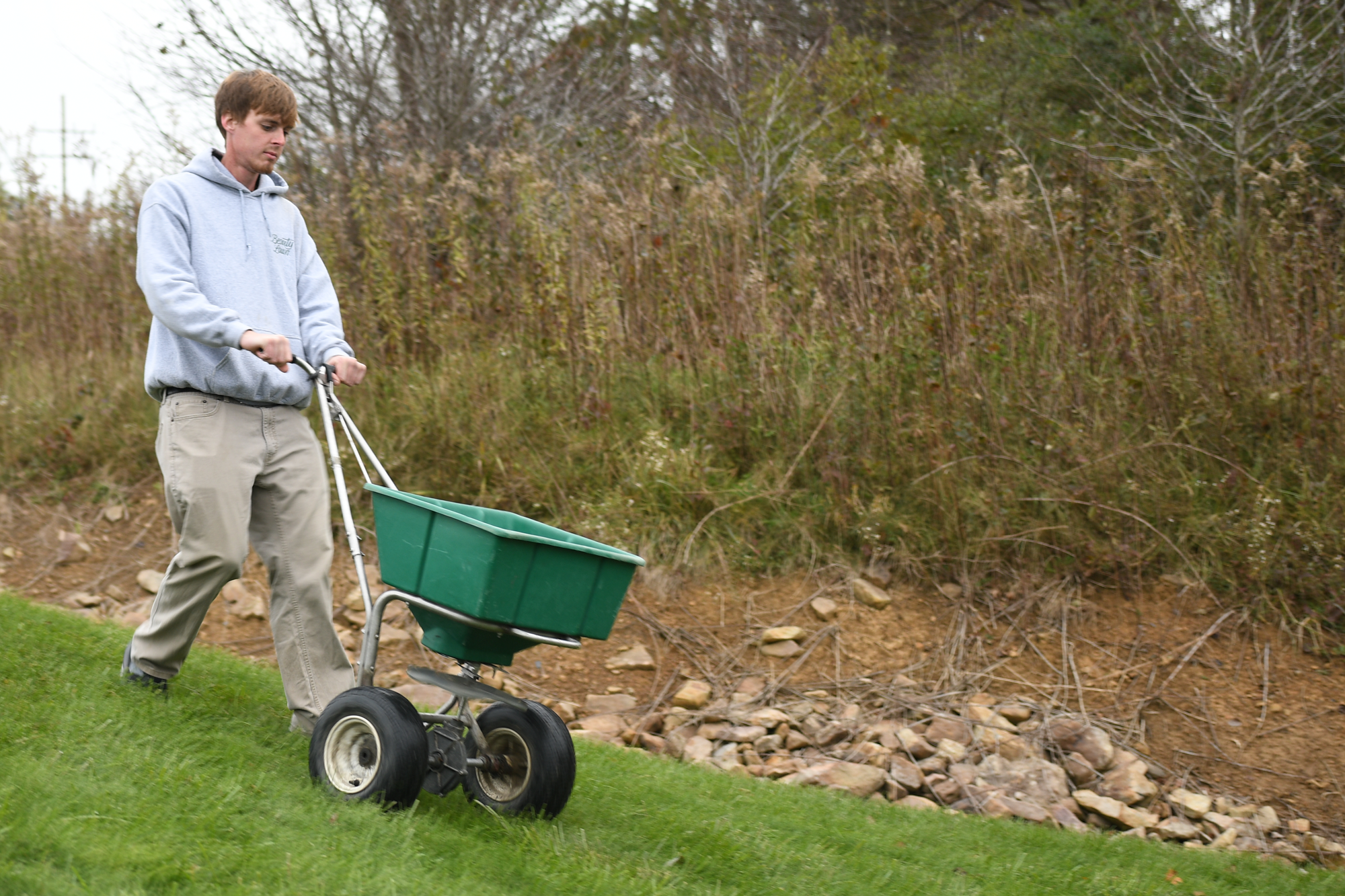 Beauty Lawn technician performing winter feeding service